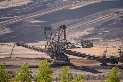 Large industrial spreader machine operating in open pit lignite coal mine Stock Photos