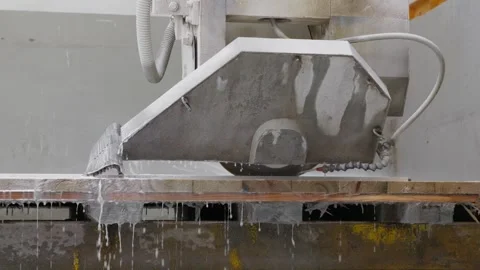 Large industrial stone cutting machine with water jets is shown in a workshop Stock Footage 320371344