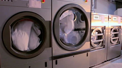 Large industrial washing machines in the hotel laundry Stock Footage