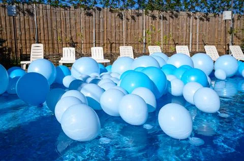 Large inflatable blue balls in the pool Stock Photos