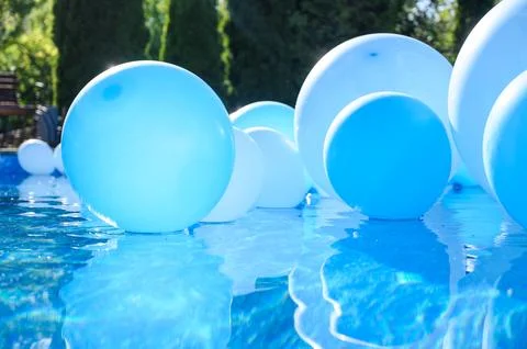 Large inflatable blue balls in the pool Stock Photos