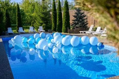 Large inflatable blue balls in the pool Stock Photos