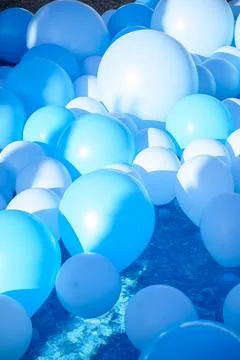 Large inflatable blue balls in the pool Stock Photos