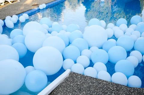 Large inflatable blue balls in the pool Stock Photos