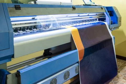 Large inkjet printer head working on blue vinyl Stock Photos
