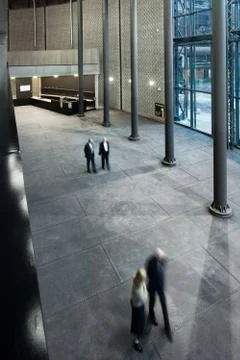 Large interior of modern technical institution with people Foto stock