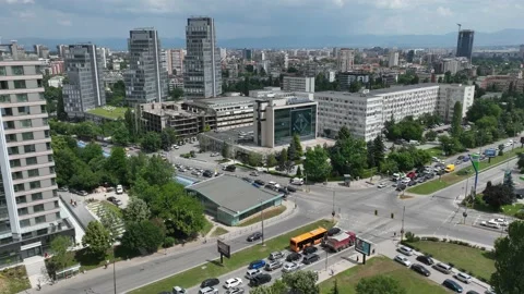 A large intersection with heavy traffic and fast passing clouds. Stock Footage 197069911