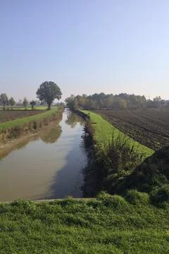 Large irrigation canal between fields Stock Photos