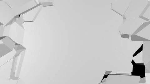 Large jagged pieces fall off the edges of the white surface, revealing a black Stock Footage 152792602