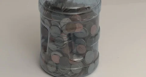 Large Jar of Change - Rotating Stock Footage 91277853