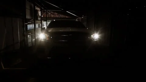 A large jeep moves through the tunnel and drives into the parking lot Stock Footage 134243644