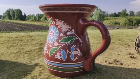 Large jug in the countryside Stock Footage 134378465