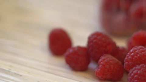 Large juicy raspberry berries lie on a wooden white table. panoramic shooting Stock Footage 82037510