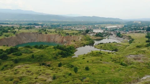 Large karst dips due to flooded salt mines near Solotvyno, Slatina. The Stock Footage 94144362