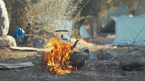 camping - kettle over campfire, Stock Video
