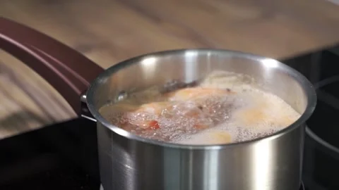 Large king prawns boiled in boiling water Stock Footage 130691786