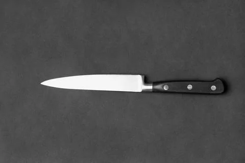 Large kitchen knife on a black background Stock Photos