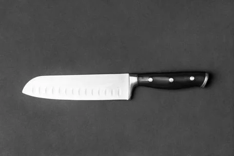 Large kitchen knife on a black background top view Stock Photos