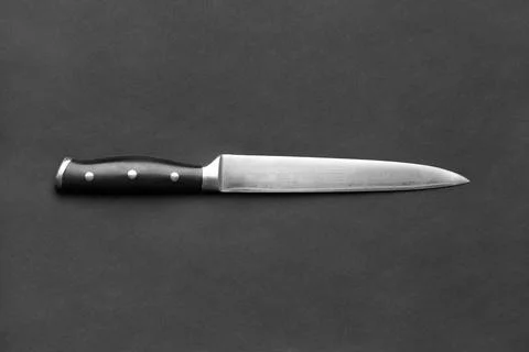 Large kitchen knife on a black background, copy space. Stock Photos