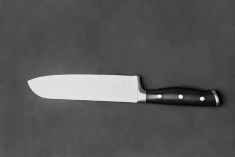 Large kitchen knife on a black background Stock Photos