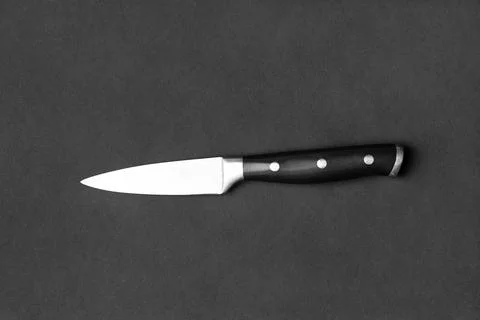 Large kitchen knife on a black background top view Stock Photos