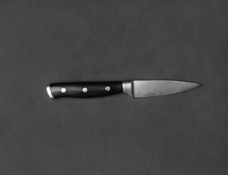 Large kitchen knife on a black background top view Stock Photos