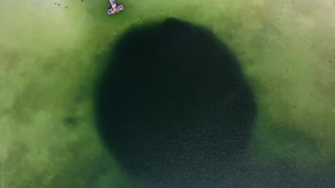 A large lake with a deep cenote inside. Video stock 157626343