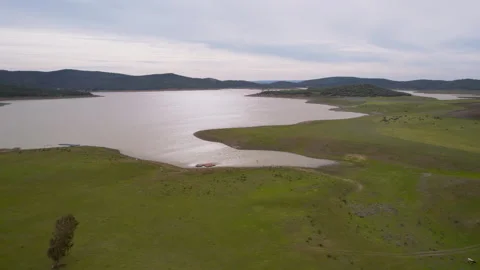 A large lake in Spain with hills in the background Stock Footage 259968759
