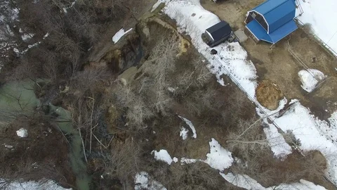 Large landslide that took a bite out of a hill near houses - 24fps 1080p Stock Footage 104068779