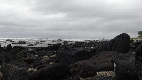 Large lava rock in a tidal pool Stock Footage 81641022