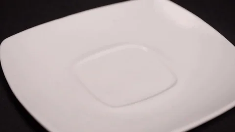 Large leaf tea is poured on a white saucer Stock Footage 75478077