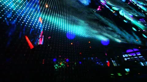 Large LED screen size of entire wall with changing picture in nightclub Stock Footage 8921807