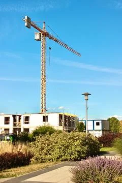 A large lifting crane is working on a construction site in the city Foto stock