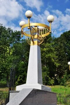 Large lighting pole. A pillar with four lamps. Stock Photos