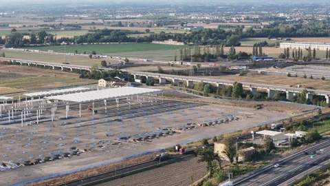 Large logistics complex under construction beside A1/A21 interchange and Via Stock Footage 346429254