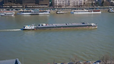 A large long boat sails across the Danube. Stock Footage 129085608