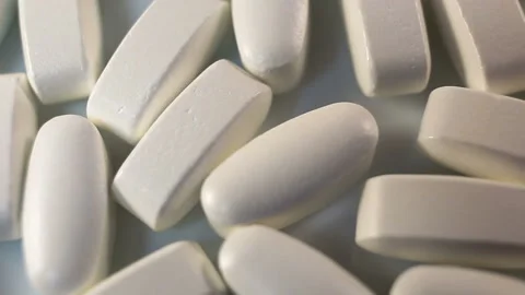 Large long tablets in a shiny shell move smoothly from bottom to top. Stabilizat Stock Footage 144643377