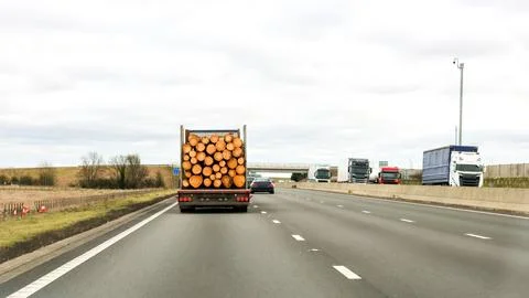 A Large Lorry Designed For Carrying Huge Logs From Forest To Factory Drivin.. Stock Photos