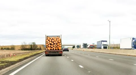 A Large Lorry Designed For Carrying Huge Logs From Forest To Factory Drivin.. Stock Photos