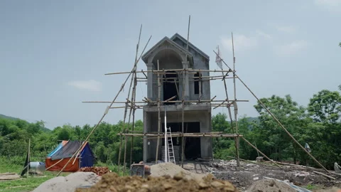 Large luxury house under construction between the mountains and nature in a Video stock 303845428