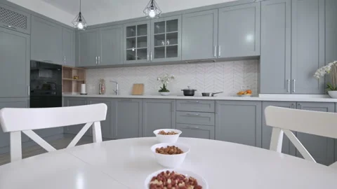Large luxury moden classic gray kitchen with white dining table Stock Footage 155439890