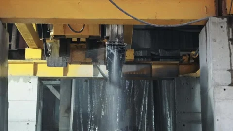 A large machine with a circular saw for cutting blanks from porcelain stoneware Stock Footage 243161257
