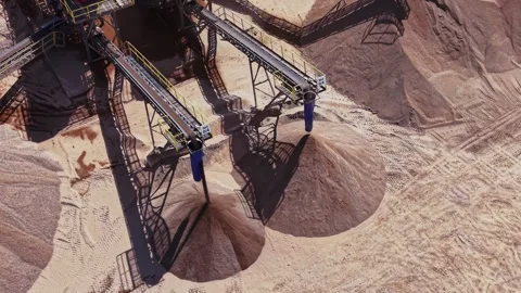 Large machine processing sand in a construction site during daytime Stock Footage 338240985