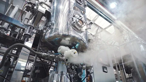 Large machine release steam from valve slow motion wide shot Stock-Footage 158674061