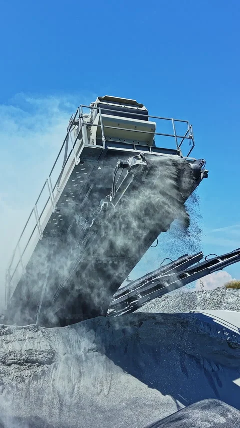 Large machinery operates in granite quarry and processes stone materials during Stock Footage 337895786