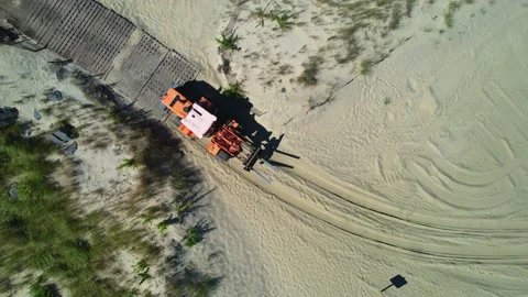 Large Machinery on the Sandy Beach 4k Stock Footage 214376637