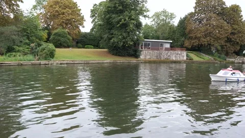 Large manor and residences on river Thames Stock Footage 137700390