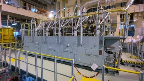 A large marine diesel engine stands in the ships engine room Stock Footage 303356404