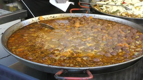 Large meatball dish being served Stock Footage 115704009