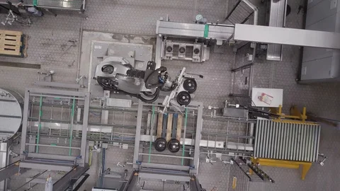 Large mechanical automated robot lifting and moving items, drone aerial 4K Stock Footage 101153995